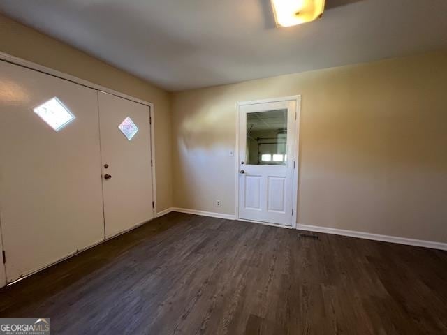 foyer entrance featuring dark hardwood / wood-style floors