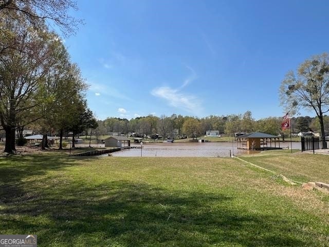 surrounding community featuring a lawn