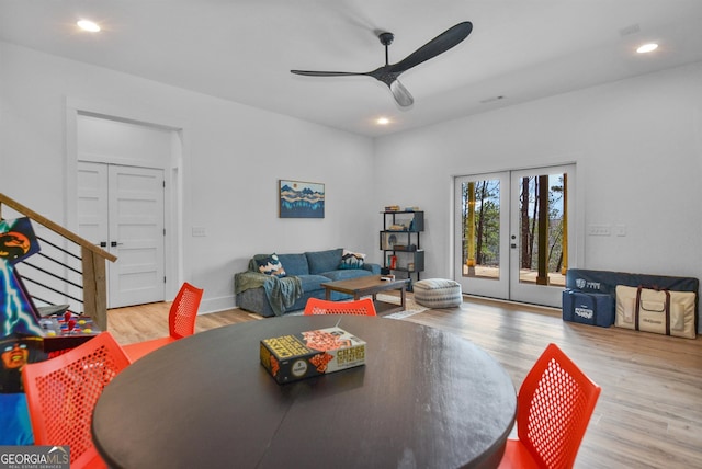 dining room with ceiling fan, light hardwood / wood-style flooring, and french doors