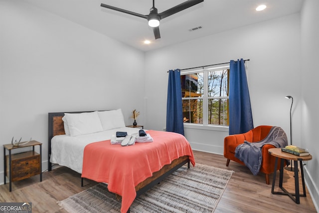 bedroom featuring ceiling fan and hardwood / wood-style flooring