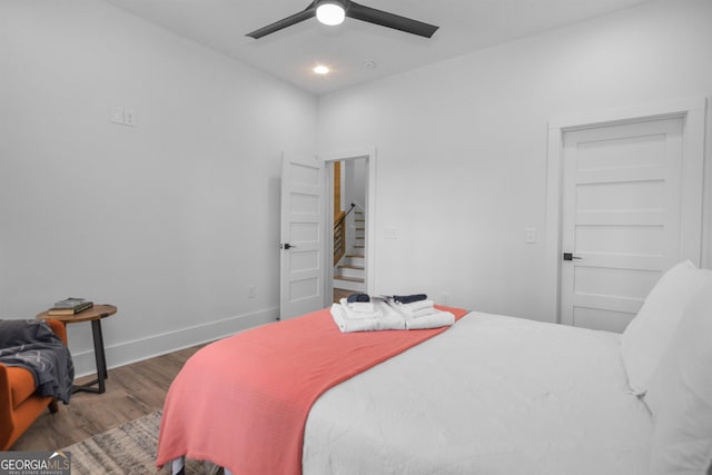 bedroom featuring ceiling fan and dark wood-type flooring