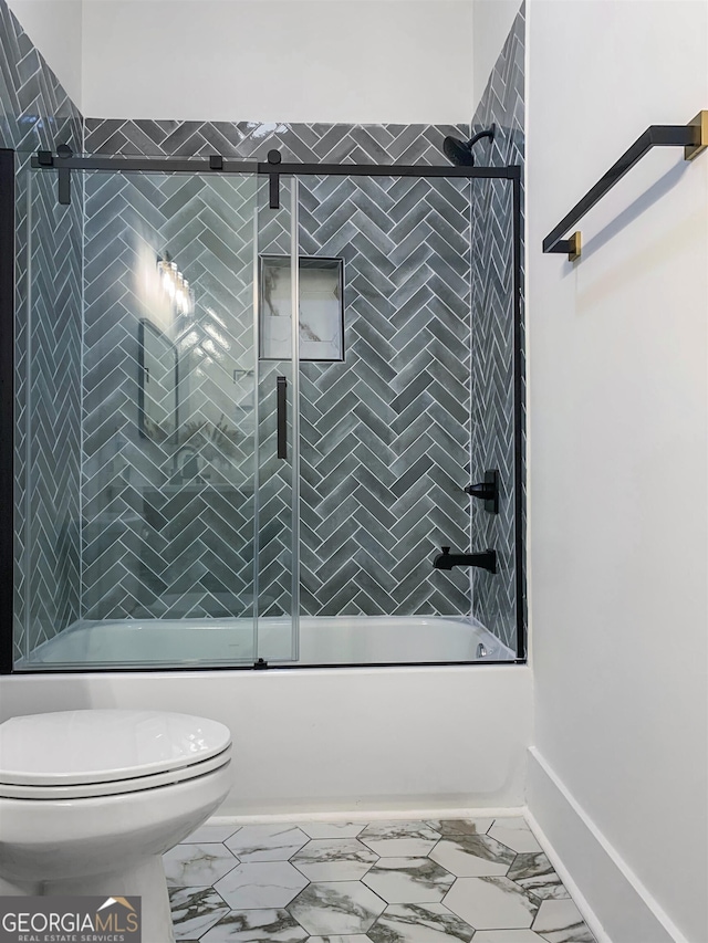 bathroom featuring shower / bath combination with glass door, tile floors, and toilet