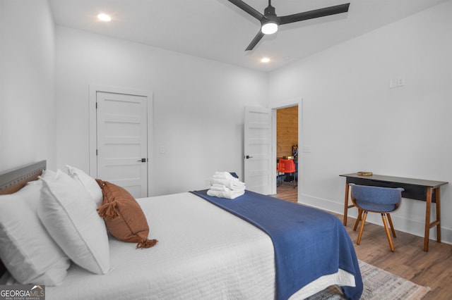 bedroom featuring ceiling fan and hardwood / wood-style flooring