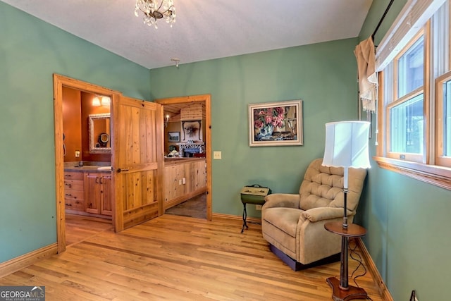 living area with light hardwood / wood-style floors