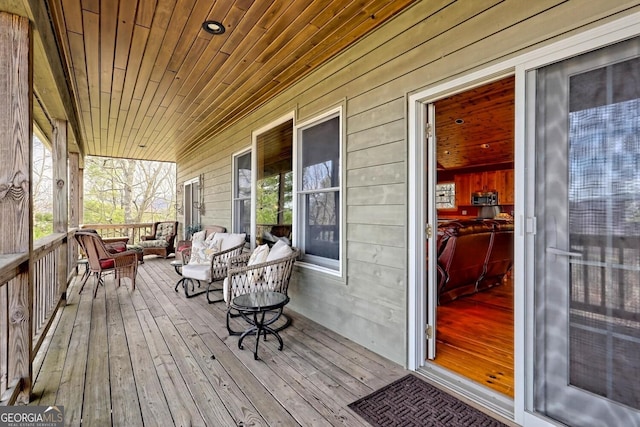 wooden terrace with covered porch