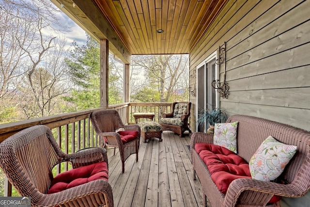 wooden deck with an outdoor hangout area