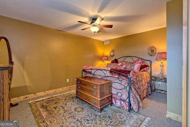 bedroom featuring light carpet and ceiling fan