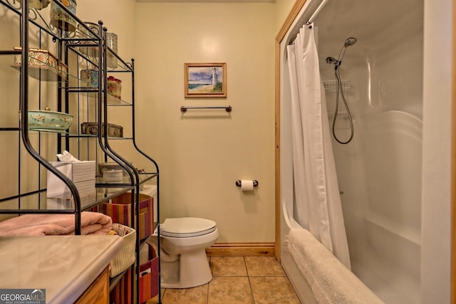 full bathroom featuring toilet, shower / bath combo, vanity, and tile patterned flooring