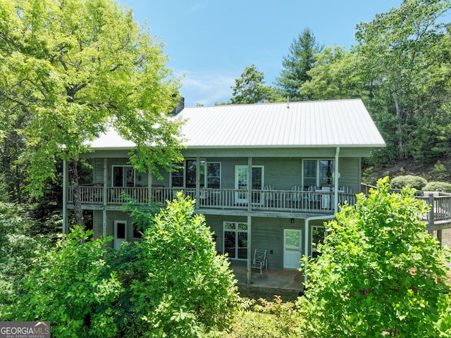 rear view of property featuring a patio area