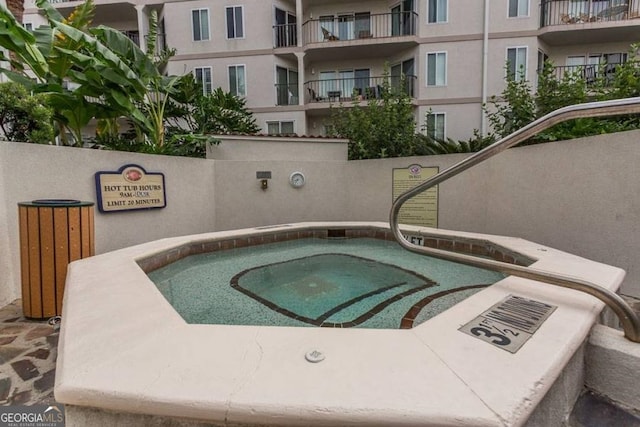 view of pool featuring a hot tub