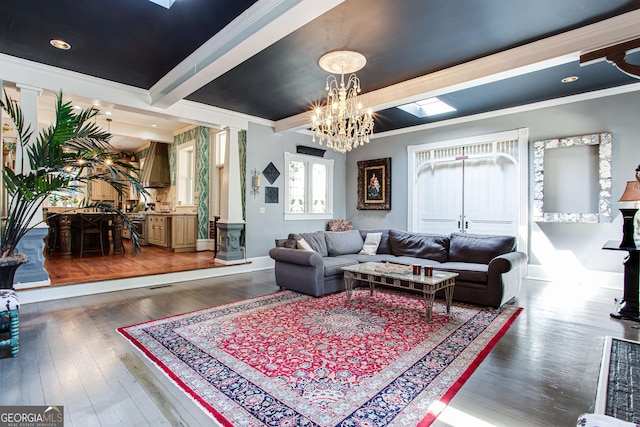 living room with a notable chandelier, crown molding, dark hardwood / wood-style floors, and beam ceiling