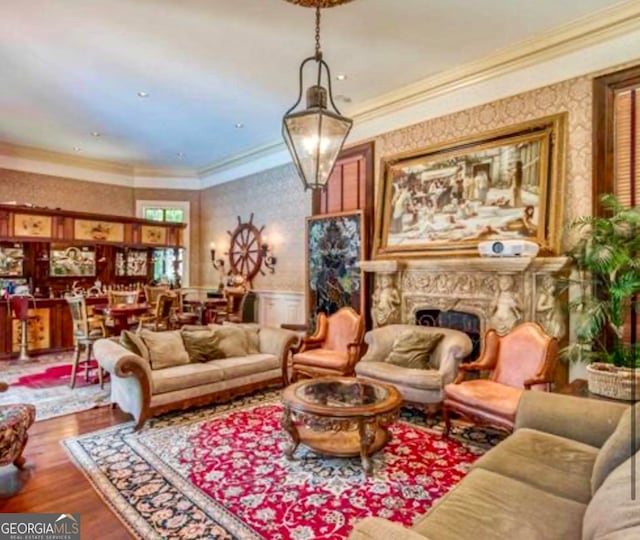 living room featuring dark hardwood / wood-style flooring and ornamental molding