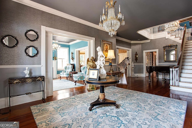 interior space featuring dark hardwood / wood-style flooring, crown molding, and a chandelier