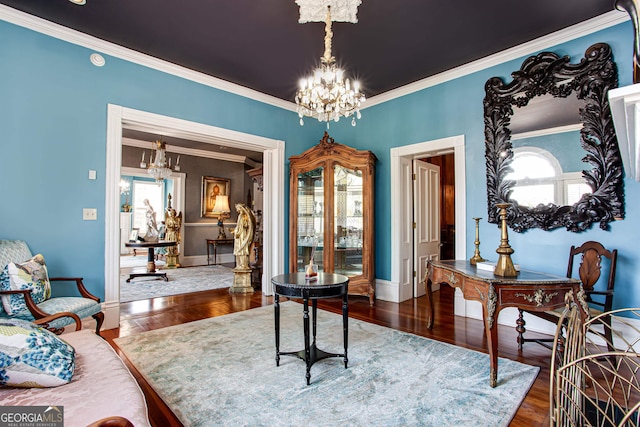 interior space with dark hardwood / wood-style flooring, ornamental molding, and a healthy amount of sunlight