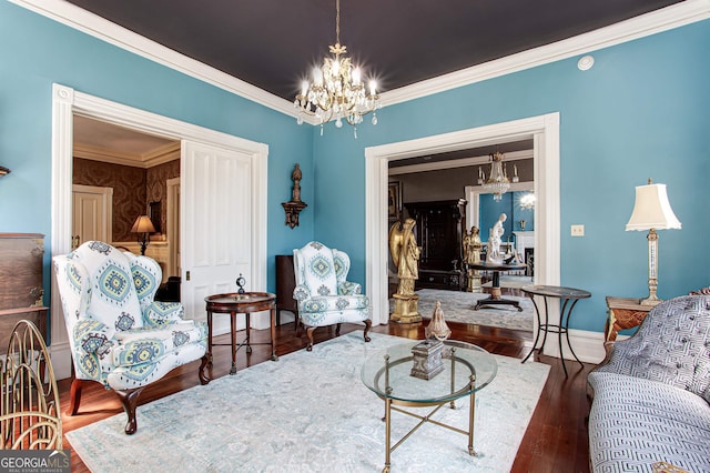 living room with crown molding, dark wood-type flooring, and a chandelier