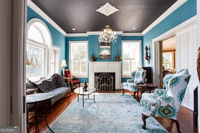 interior space with a notable chandelier, ornamental molding, and dark hardwood / wood-style floors