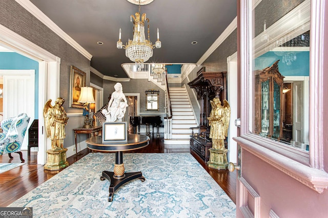 interior space featuring ornamental molding, a notable chandelier, and dark wood-type flooring