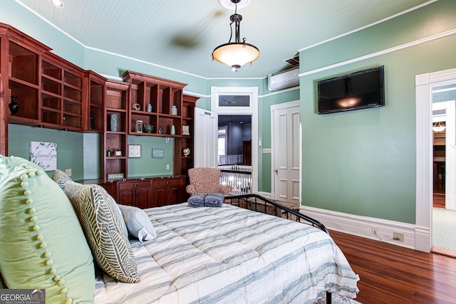 bedroom featuring an AC wall unit and light hardwood / wood-style flooring