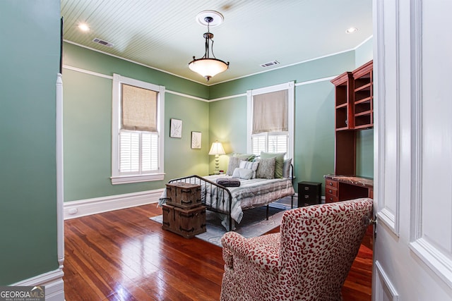 bedroom featuring dark hardwood / wood-style flooring