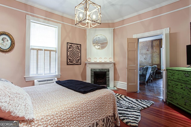 bedroom featuring ornamental molding, dark wood-type flooring, a chandelier, and a wall mounted AC