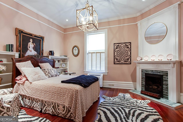 bedroom with dark hardwood / wood-style floors, crown molding, and a notable chandelier