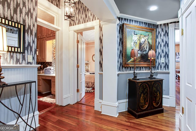 corridor with dark hardwood / wood-style flooring and crown molding