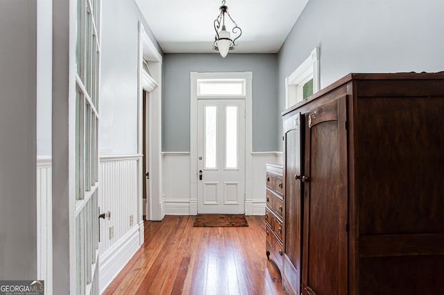 foyer entrance featuring hardwood / wood-style floors and plenty of natural light