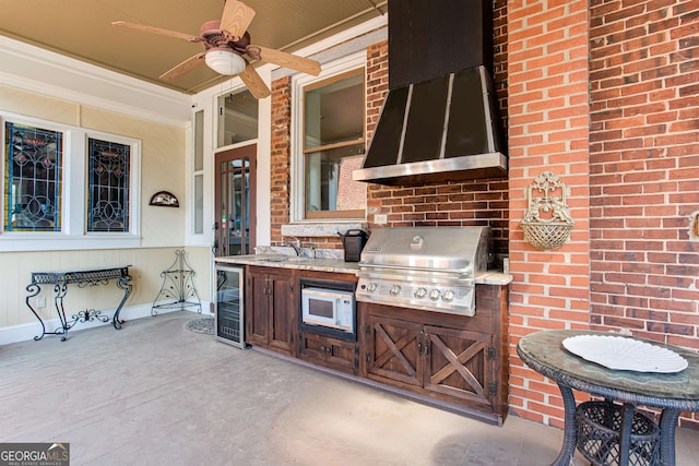 view of terrace featuring wine cooler, a grill, area for grilling, ceiling fan, and sink