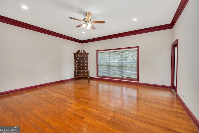 unfurnished room with ceiling fan, ornamental molding, and light hardwood / wood-style floors