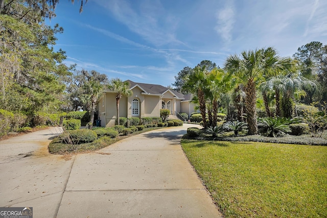 view of front of home with a front lawn