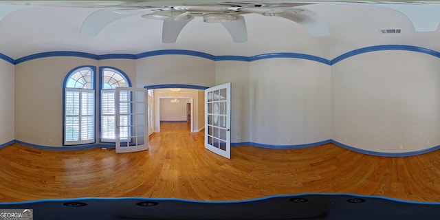 interior space featuring ceiling fan, ornamental molding, and french doors