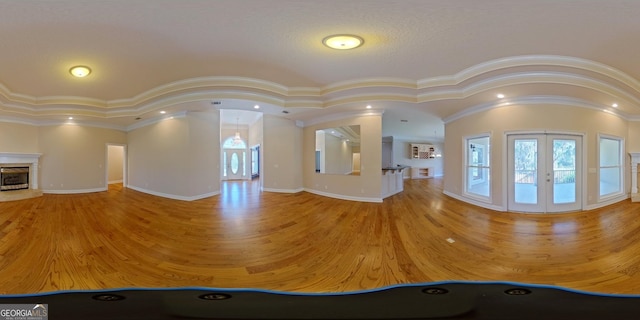 interior space with french doors and crown molding