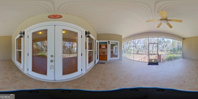 exterior space with ceiling fan and french doors