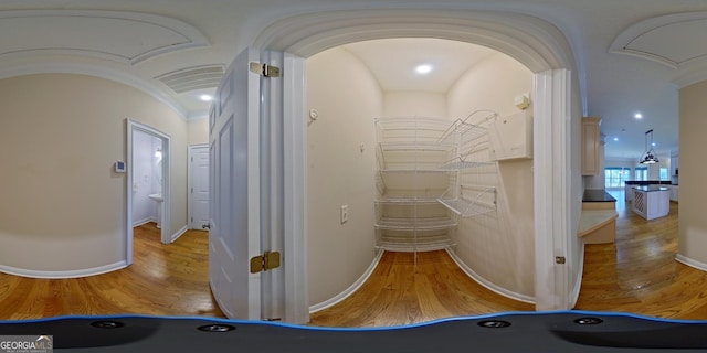 hallway with light hardwood / wood-style flooring