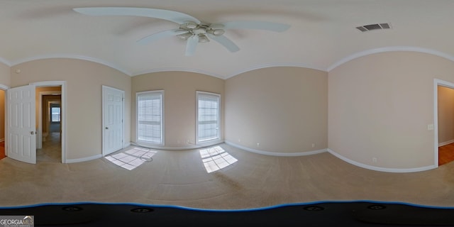 spare room featuring ceiling fan and light carpet