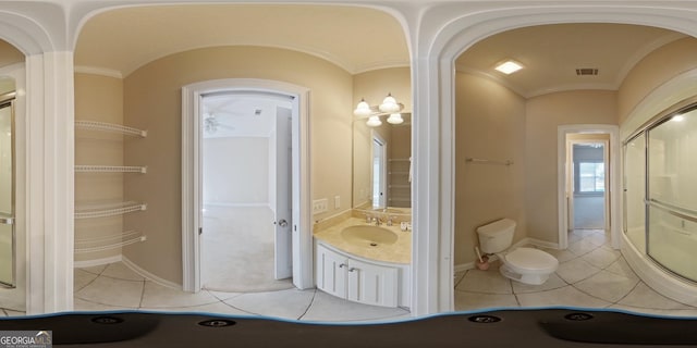 bathroom featuring tile floors, toilet, and oversized vanity