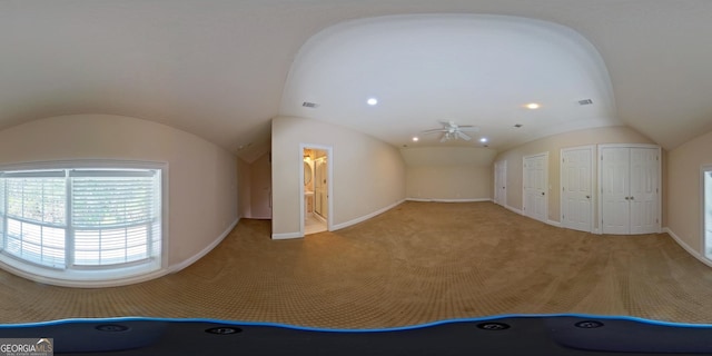 bonus room with ceiling fan, light carpet, and vaulted ceiling