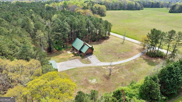 birds eye view of property with a rural view