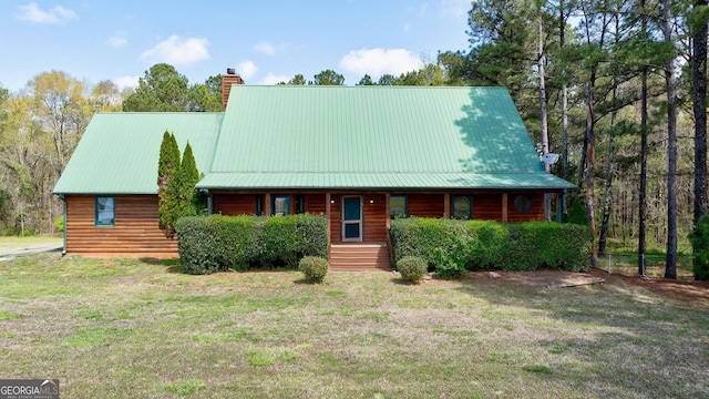 log-style house with a front yard