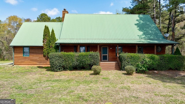 log home featuring a porch and a front yard