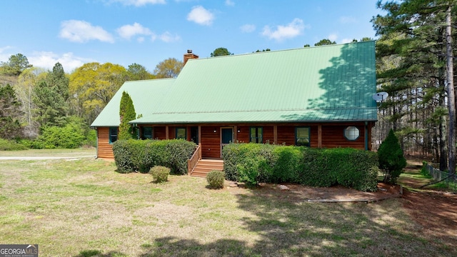 log home with a front lawn