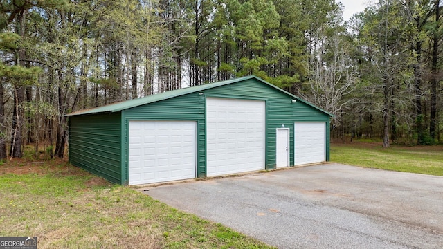 garage with a lawn