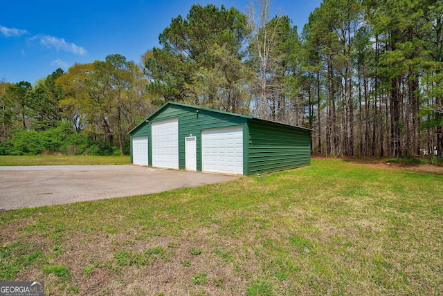 garage with a yard