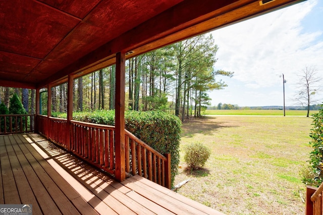 deck featuring a lawn