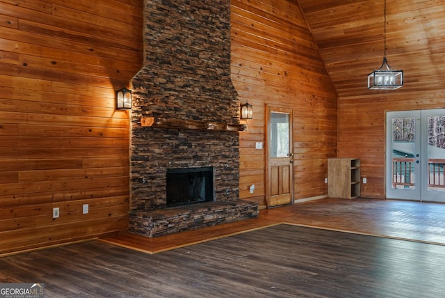 unfurnished living room featuring dark hardwood / wood-style flooring, high vaulted ceiling, wood walls, and wood ceiling