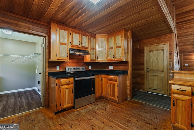 kitchen with dark hardwood / wood-style flooring, wooden walls, wood ceiling, and stainless steel electric range oven