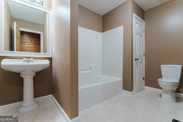 bathroom with a textured ceiling,  shower combination, toilet, and tile floors