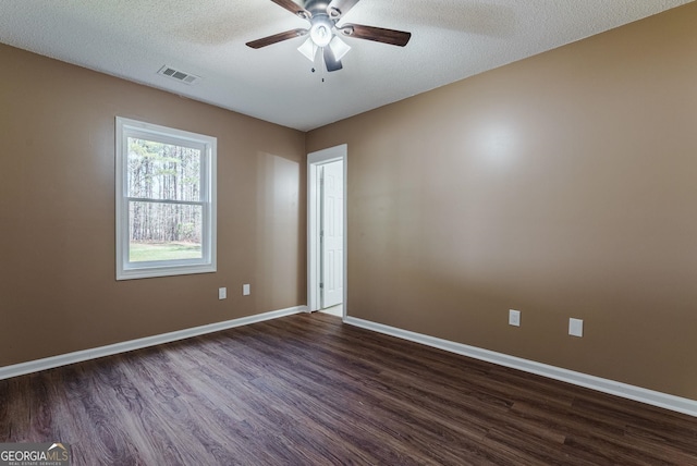 unfurnished room featuring dark hardwood / wood-style floors, a textured ceiling, and ceiling fan