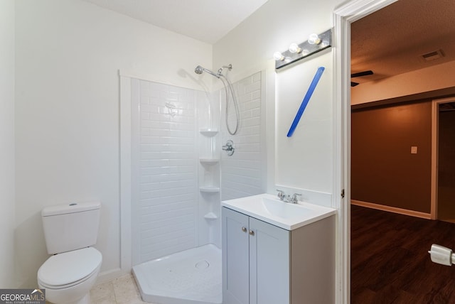 bathroom with walk in shower, toilet, vanity, and wood-type flooring