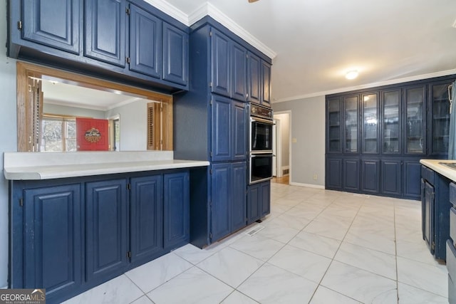 kitchen featuring crown molding and blue cabinetry